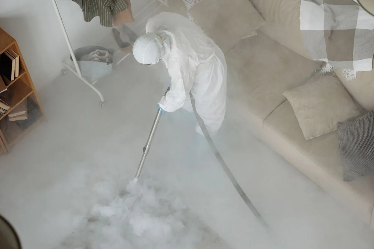 Biohazard cleanup technician in protective equipment, Route 7 Gateway, CT